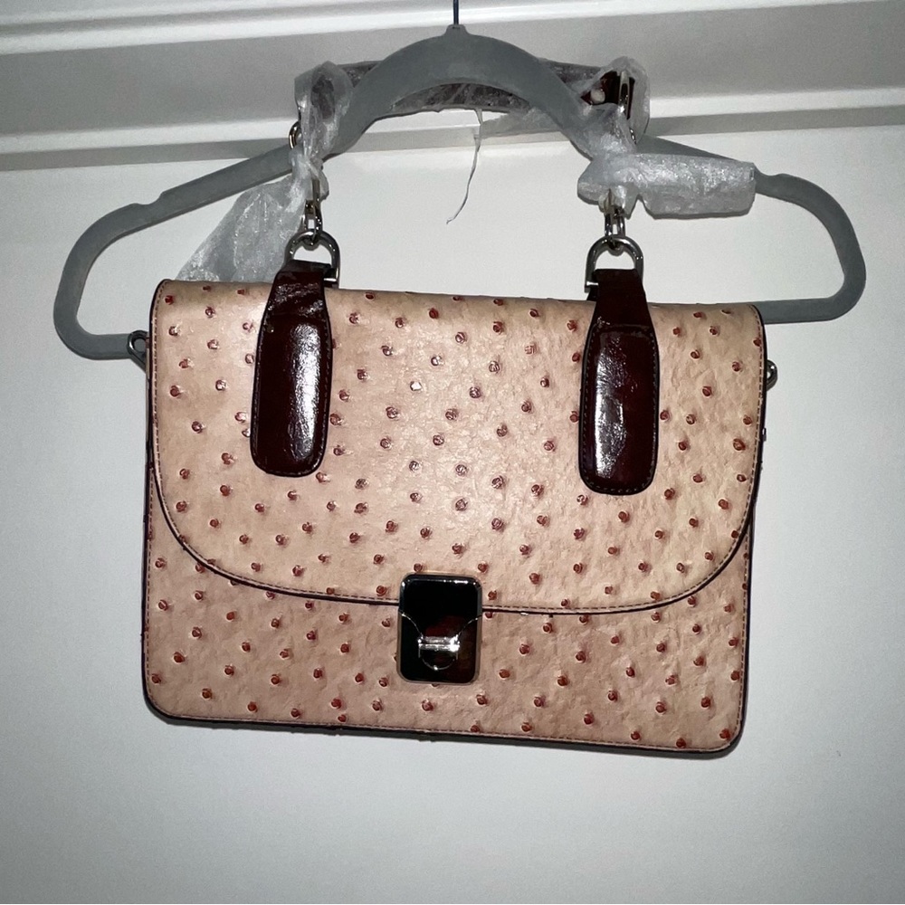 Blush Croc accordion purse.